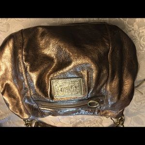 Gold coach bag